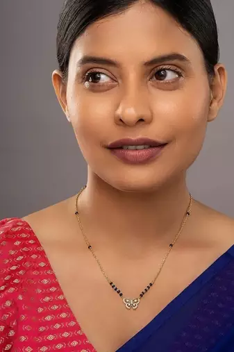 white silver mangalsutra with gold accent black bead pendant
