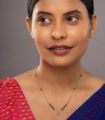 white silver mangalsutra with gold accent black bead pendant