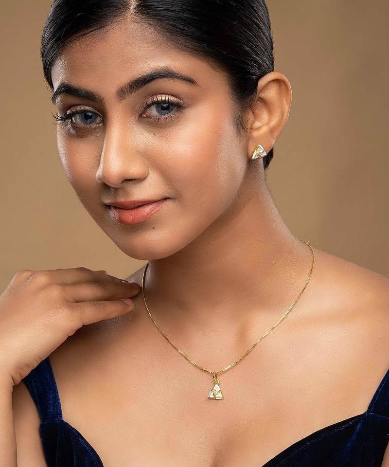 Gold plated blue stone pendant necklace set in sterling silver