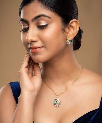 gold-plated sterling silver green stone swirl pendant set 1