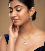 gold-plated sterling silver green stone swirl pendant set