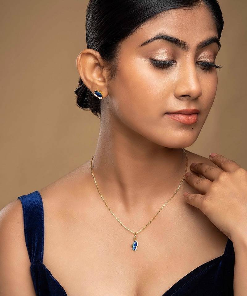 Gold plated blue stone pendant necklace set in sterling silver