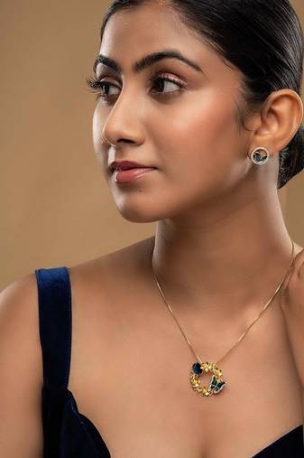 Gold plated blue stone pendant necklace set in sterling silver