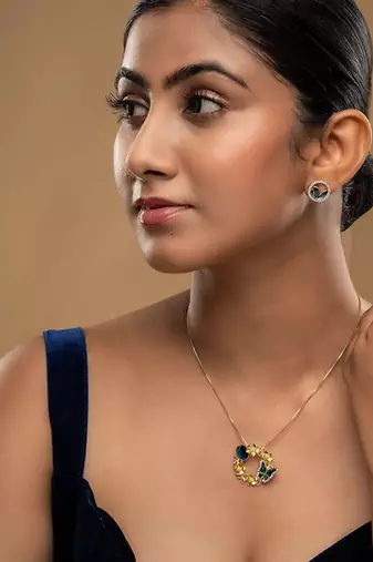 Gold plated blue stone pendant necklace set in sterling silver