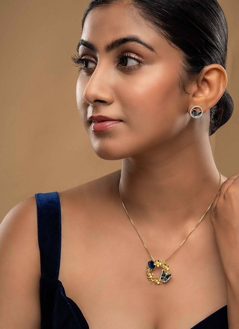 Gold plated blue stone pendant necklace set in sterling silver