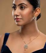 gold plated necklace set with green stone accent