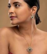 green stone necklace set with gold plated styling