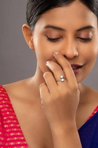 white silver ring with silver plated detailing