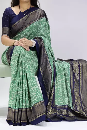 green color  printed with foil work and contrast border  soft tussar silk saree with unstitched blouse