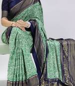 green color  printed with foil work and contrast border  soft tussar silk saree with unstitched blouse
