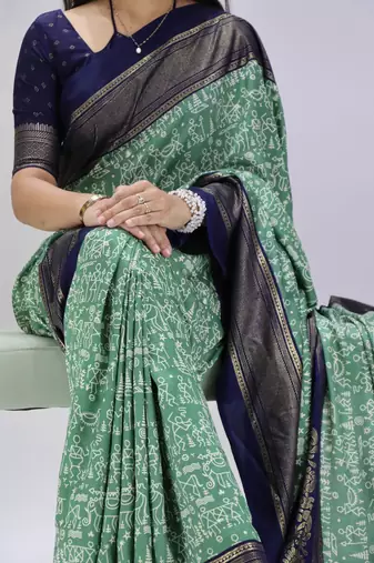 green color  printed with foil work and contrast border  soft tussar silk saree with unstitched blouse