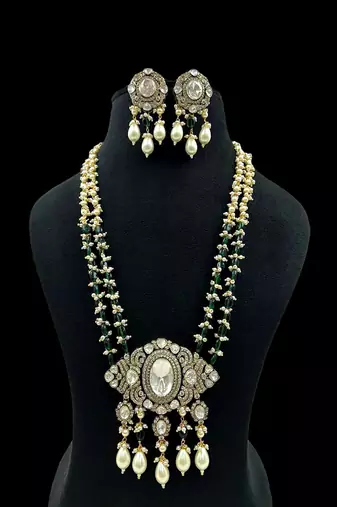 Regal moissanite polki long necklace set with pearl & green bead detailing traditional gold finish jewelry by treemoda