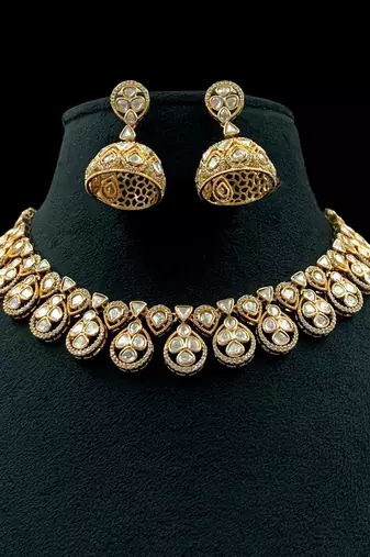 Premium moissanite polki necklace with intricate jhumka earrings traditional gold finish jewelry by treemoda