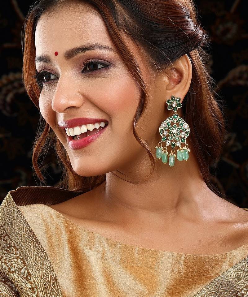Gold plated kundan green stone dangler earrings