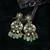 Gold plated kundan green stone dangler earrings