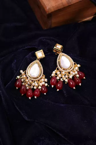 Gold plated kundan red stone dangler earrings