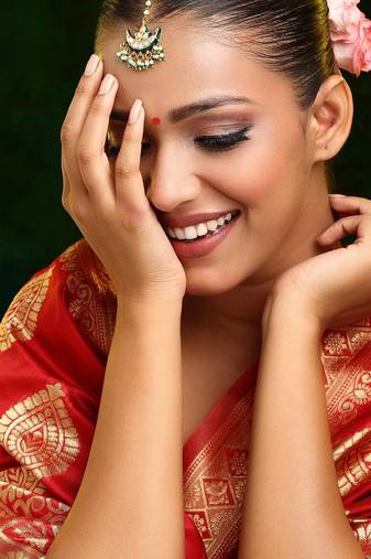 Gold plated kundan green stone maang tikka