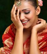 Gold plated kundan green stone maang tikka