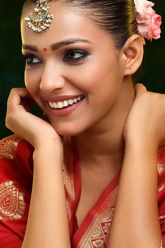 Gold plated kundan green stone maang tikka