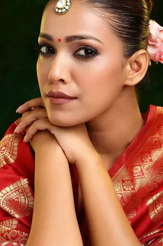 Gold plated kundan green stone maang tikka