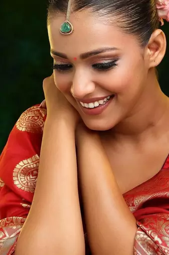 Gold plated kundan green stone maang tikka