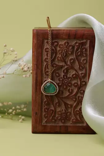Gold plated kundan green stone maang tikka