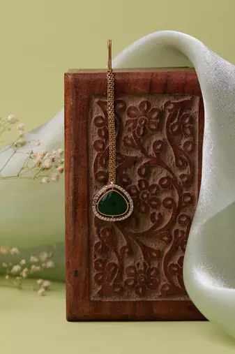Gold plated kundan green stone maang tikka