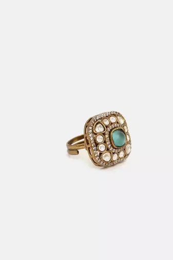 Gold plated kundan green stone ring