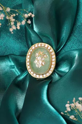 Gold plated kundan green stone ring