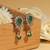 Ethnic oval and leaf design gold plated green kundan stone dangle earring for women and girls