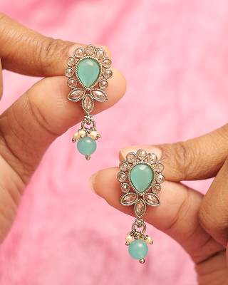 Oval and leaf design gold plated sky blue kundan stone dangle earring for women and girls 1