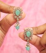 Oval and leaf design gold plated sky blue kundan stone dangle earring for women and girls