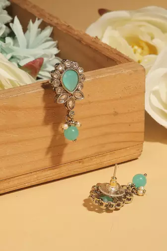 Oval and leaf design gold plated sky blue kundan stone dangle earring for women and girls