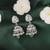 Leaf and pear shape silver plated light green kundan stone brass jhumki earring for women and girls
