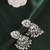 Leaf and pear shape silver plated light green kundan stone brass jhumki earring for women and girls