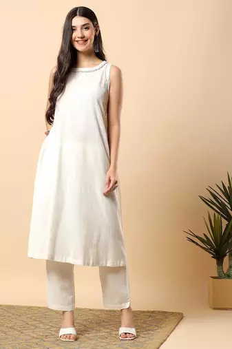 Women off white cotton flex solid & hand embroidery work kurta with trousers set