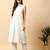 Women off white cotton flex solid & hand embroidery work kurta with trousers set