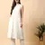 Women off white cotton flex solid & hand embroidery work kurta with trousers set