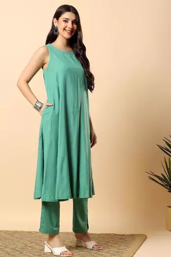 Women sea green cotton flex solid & hand embroidery work kurta with trousers set