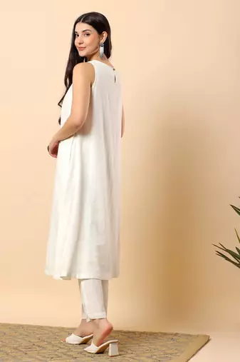 Women off white cotton flex solid & hand embroidery work kurta with trousers set