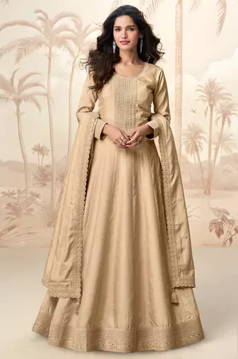 Cream embroidery & sequins  work silk gown- free size stitching (size upto 42")