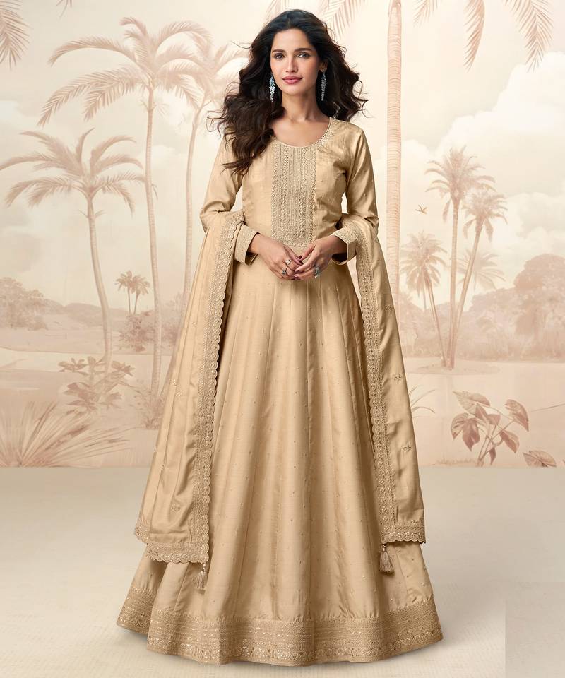 Cream embroidery & sequins  work silk gown- free size stitching (size upto 42")