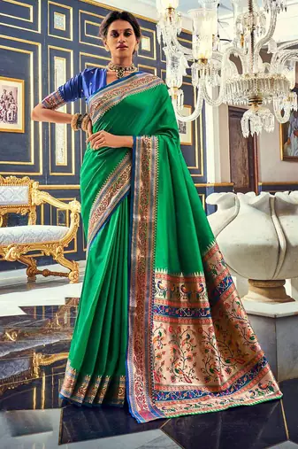 Women's dark green soft silk woven saree with unstitched silk blouse piece
