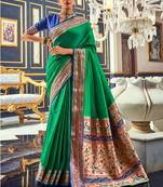 Women's dark green soft silk woven saree with unstitched silk blouse piece