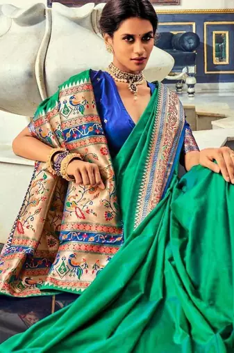 Women's dark green soft silk blend woven saree with unstitched silk blend blouse piece