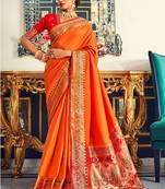 Women's orange soft silk woven saree with unstitched silk blouse piece