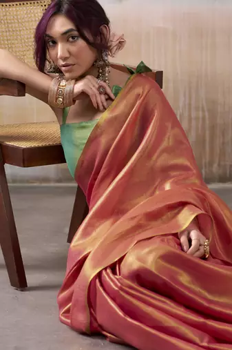 Women's peach tissue silk blend solid saree with unstitched silk blend blouse piece