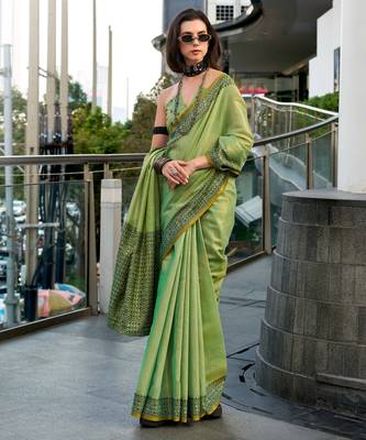 Women's green silk blend woven saree with unstitched silk blend blouse piece 1