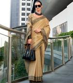 Women's beige silk blend woven  saree with unstitched silk blouse piece