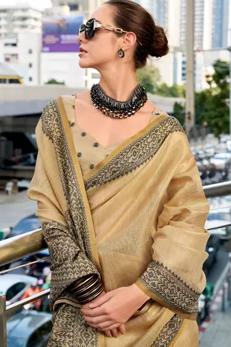 Women's beige silk blend woven  saree with unstitched silk blend blouse piece